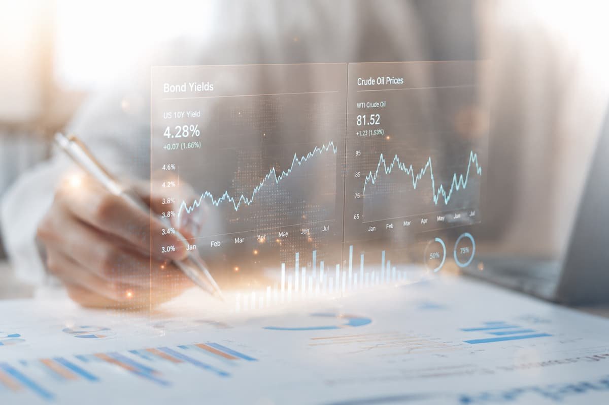 Financial analyst reviewing bond yields & market performance data on a digital investment dashboard.